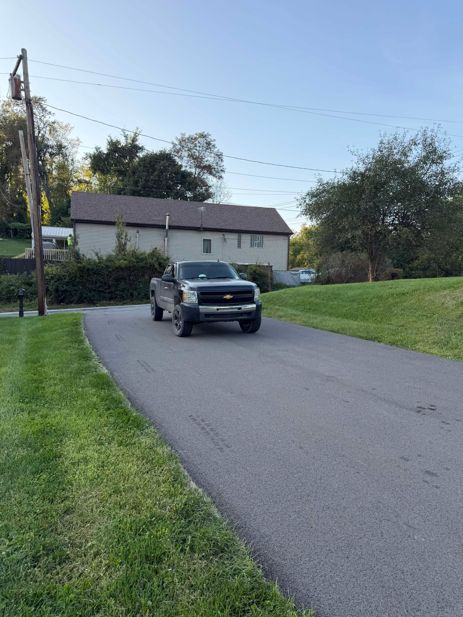 Residential asphalt driveway after sealing