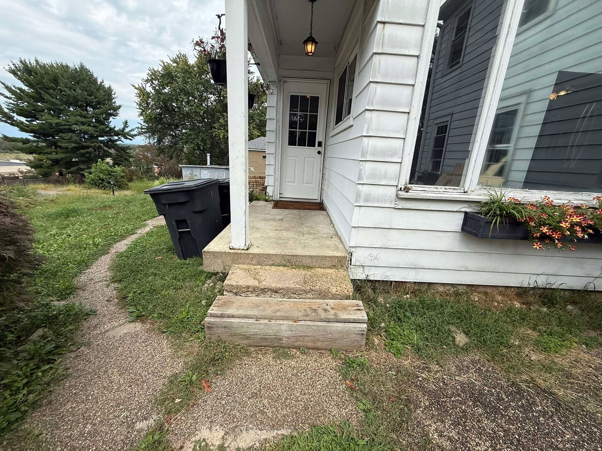 Exterior concrete entry steps before improvement