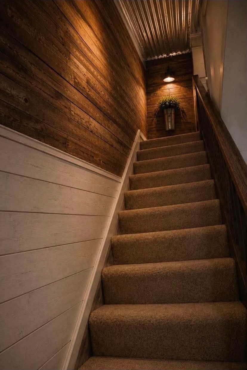 Remodeled staircase with new flooring and trim