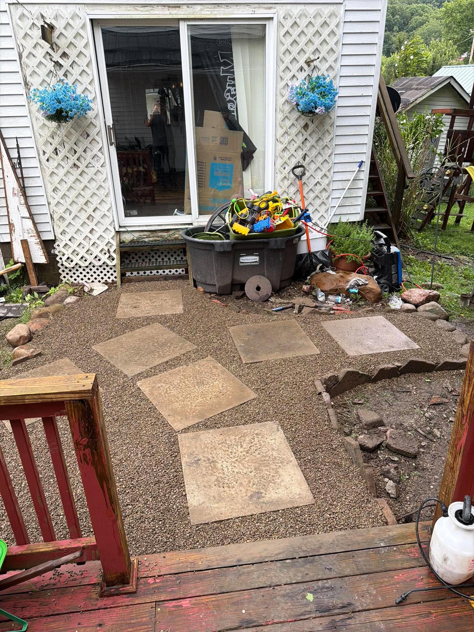 Paver walkway leading to a sliding back door